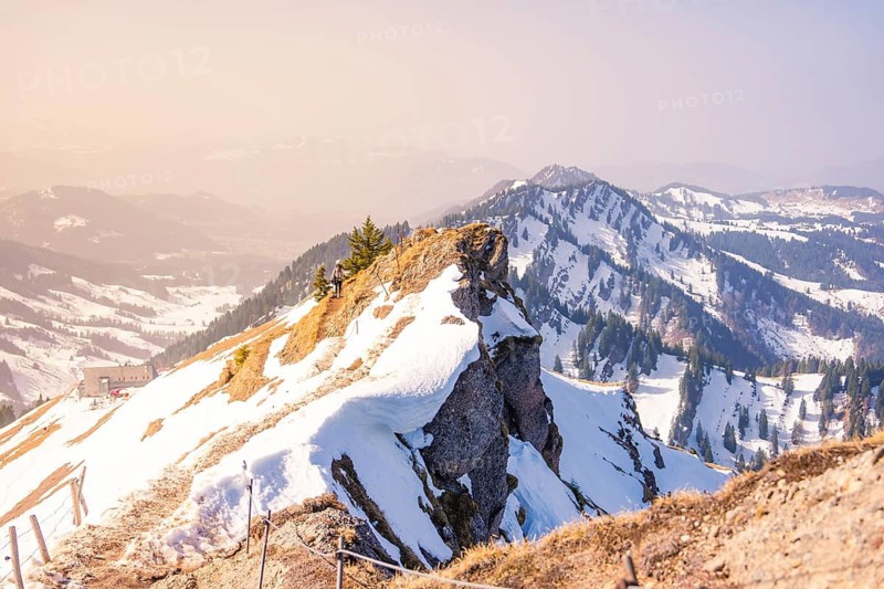 A breathtaking view of snowy mountain peaks under a clear sky that reveals vast horizons, Hochgrat Mountains, Allgäu Alps, Oberreute, Germany