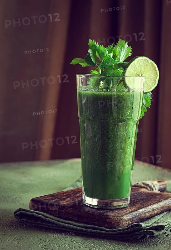 Glass with green smoothie, celery and spinach, apple and kiwi, cucumber, vegetable smoothie, breakfast, homemade, no people