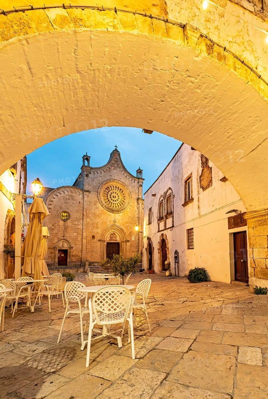 Ostuni Cathedral square seen through the Arco Scoppa archway, Apulia, Puglia, Italy