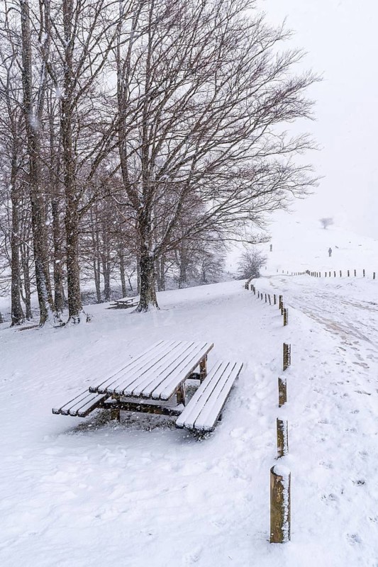 Lots of snow at the picnic area next to the refuge of Mount Aizkorri in Gipuzkoa. Snowy landscape by winter snows. Basque Country, Spain