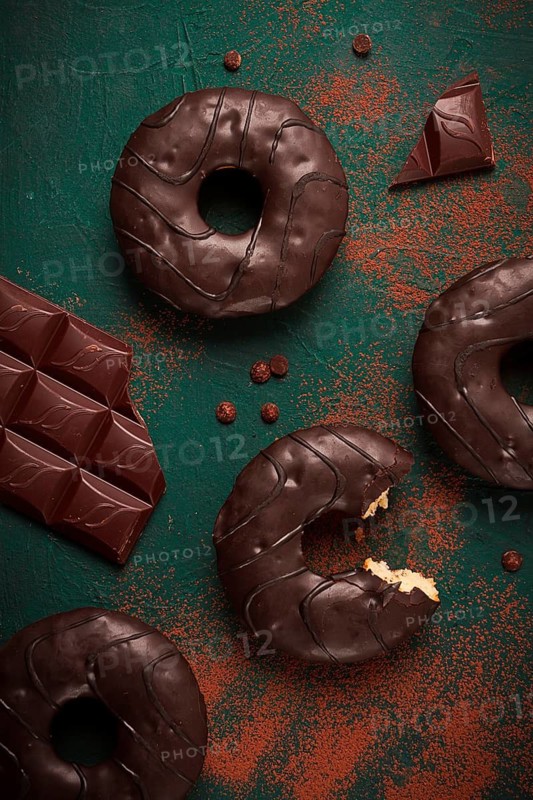 Donuts with cocoa, in chocolate glaze, top view, no people