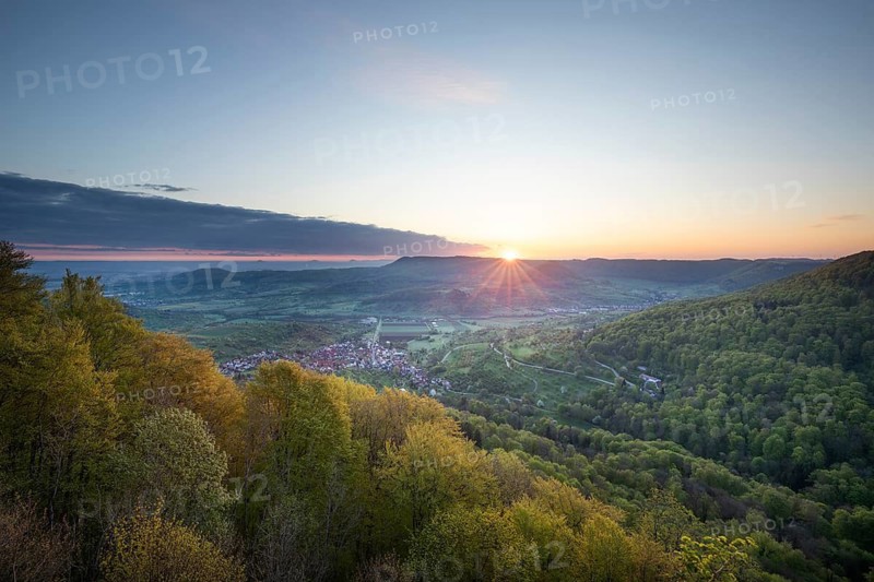 Mörikefelsen view over Zipfelbachtal valley and Drei Kaiserberge mountains at sunrise in spring. Swabian Alb, Weilheim Teck, Esslingen, Göppingen, Baden-Wuerttemberg, Germany