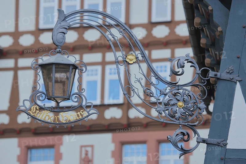 Nose sign with lantern from Luther House, home of Martin Luther, inscription, half-timbered house, Eisenach, Thuringia, Germany