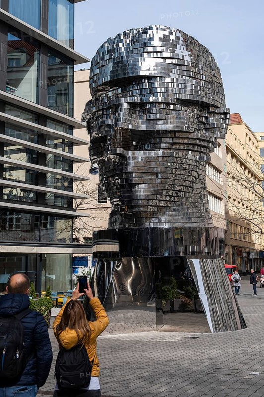 PRAGUE, CZECHIA - MARCH 25, 2023: Statue of Kafka, outdoor sculpture, author David Cerny