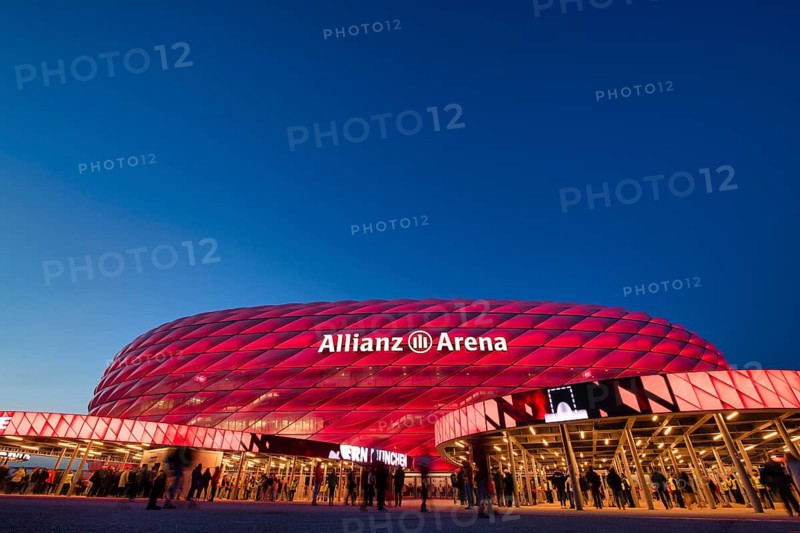 Visitors, fans, entrance area of the Allianz Arena, illuminated, overview, blue hour, in front of a Bundesliga game, Allianz Arena, Munich, Bayern, Germany