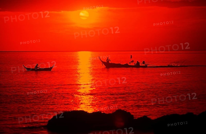 Fishing boats at sunset, silhouettes, orange filter, Ko Lanta island, Thailand, December 2002, vintage, retro, old, historic