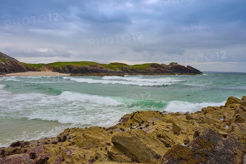 Stormy sea on a rocky coast, under a dramatically cloudy sky with rolling waves, Clachtoll, Lairg, Scotland, United Kingdom, Great Britain