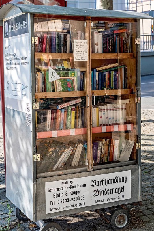 Showcase for the free exchange of used books, mobile bookcase, pedestrian zone, old town, Butzbach, Wetterau, Hesse, Germany