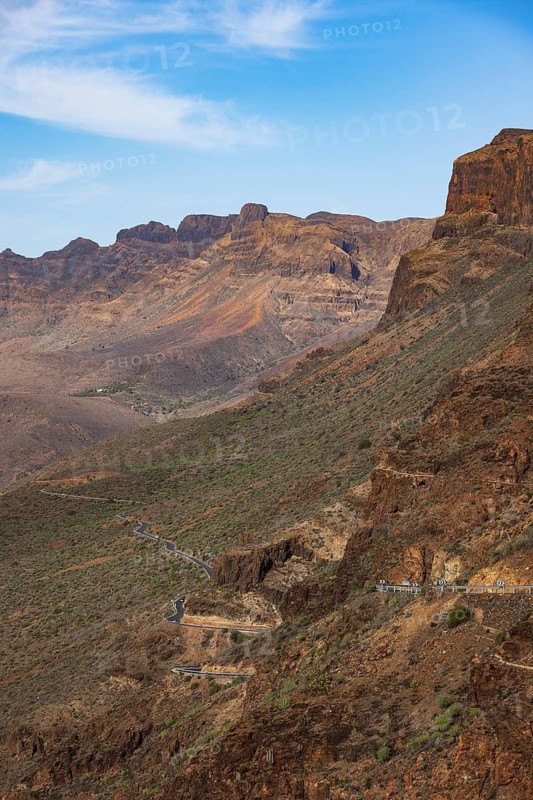 Mountain road at the Degollade de las Yeguas viewpoint with a view of the Barranco de Fataga, Gran Canaria, Canary Islands, Spain