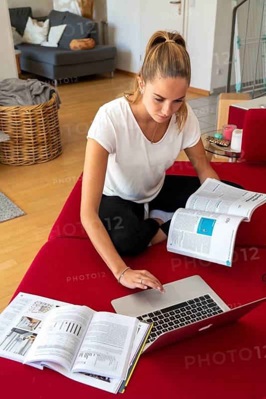 Young student learns at home, online, on her notebook