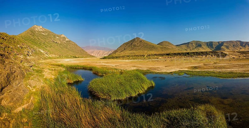 Landscape in Oman, mountains, Wadi Ashawq, road, reeds, waters Salalah, Al Mughsyal / Wadi Ashawq, Dhofar, Oman
