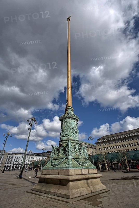 Historic column on a large square under cloudy sky, Hamburg, Germany