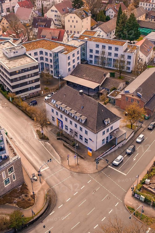 Urban intersection with a clear view of surrounding buildings in the evening, VHS Oberes Nagoldtal, Nagold, Germany