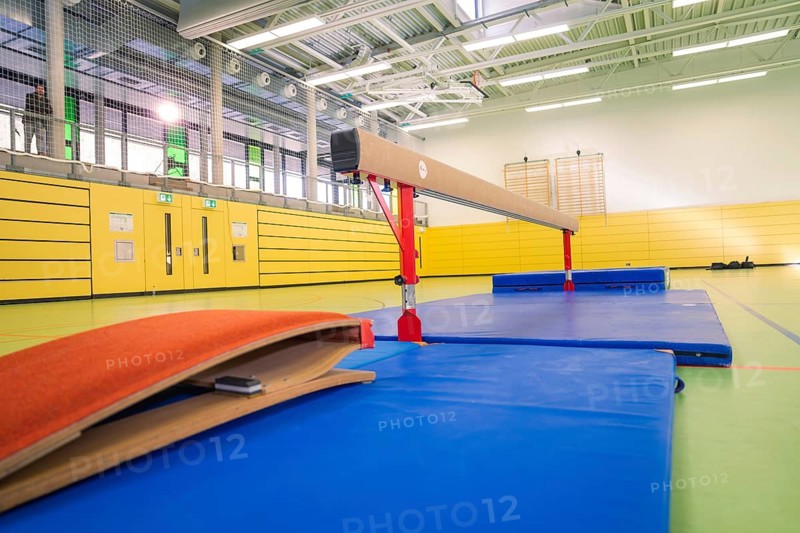 Sports hall with balance beams and damping mats, yellow and blue dominate, gymnastics, Calw, Germany