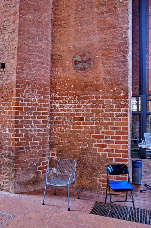 Brick column with painted paw cross in the interior of the Georgenkirche, Old Town Hanseatic City of Wismar, Mecklenburg-Western Pomerania, Germany