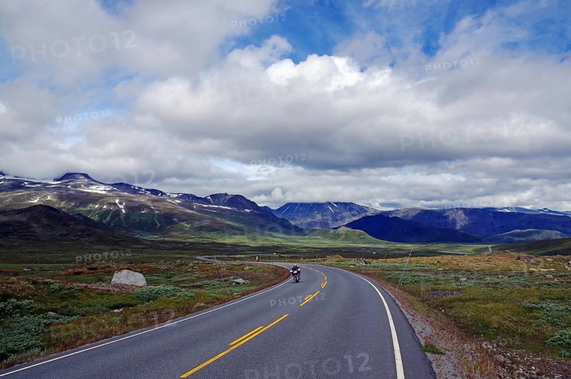 A motorcyclist rides on a mountain, Valdresflyra, Norway