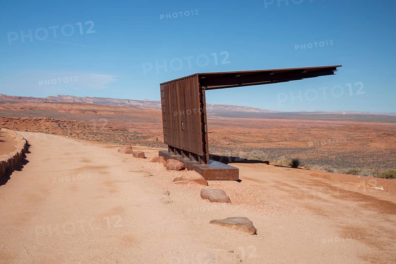 Page, Arizona - A shade structure offers tourists relief from the desert sun along a trail leading to an overlook above Horseshoe Bend on the Colorado River