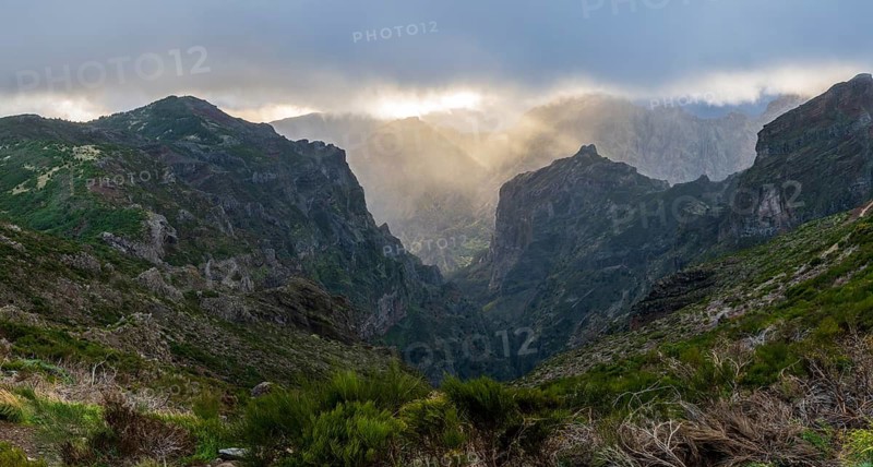 Sunset at Pico do Arieiro, sun shining through clouds, sunbeam, hiking trail PR1, Madeira, Portugal