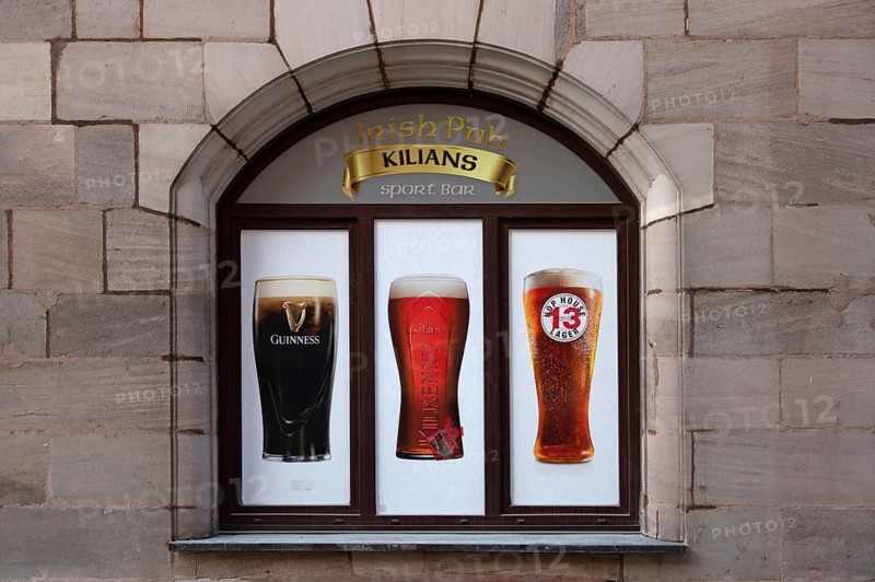 Advertisement on a window of an Irish pub, Nuremberg, Middle Franconia, Bavaria, Germany