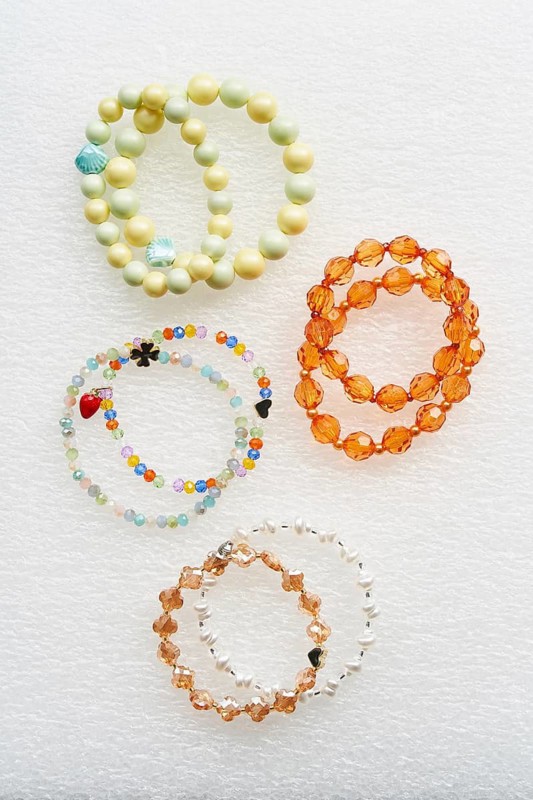 Collection of handmade bracelets crafted with colorful beads. These vibrant accessories showcase intricate designs, highlighting artistry and craftsmanship in jewelry making