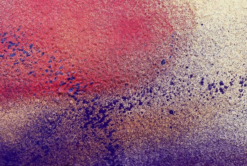 A stunning textured abstract painting with vibrant colors blending seamlessly. The intricate details and gradients of red, purple, and white create a visually captivating scene, perfect for adding a splash of color to any space
