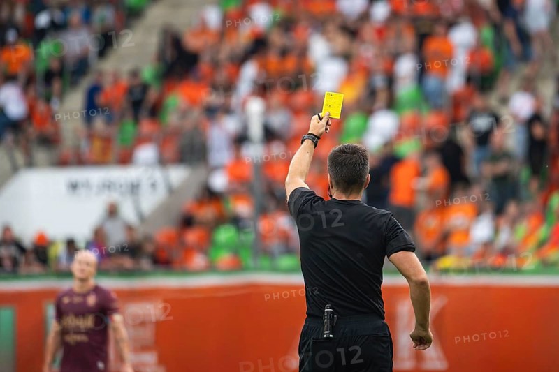 Soccer main referee shows yellow card in Lubin, Poland