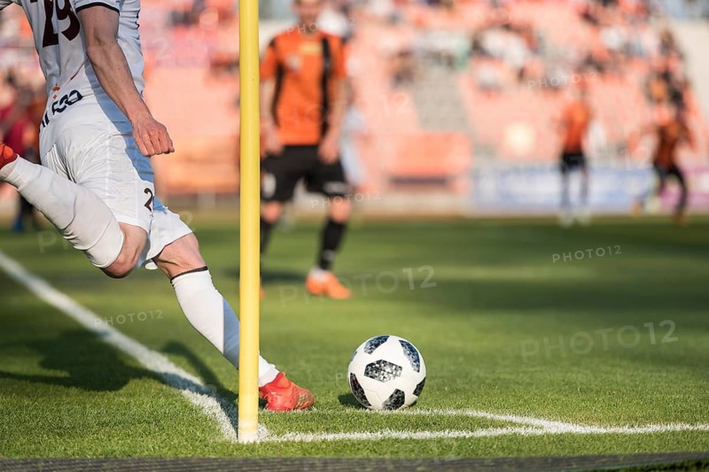 Player takes the corner during professional football match.