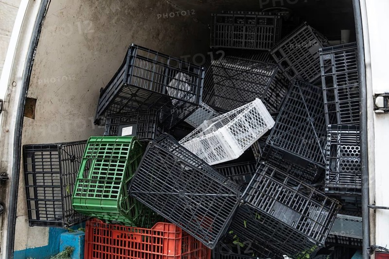 Many plastic baskets in the hold of a van, Barcelona, Spain