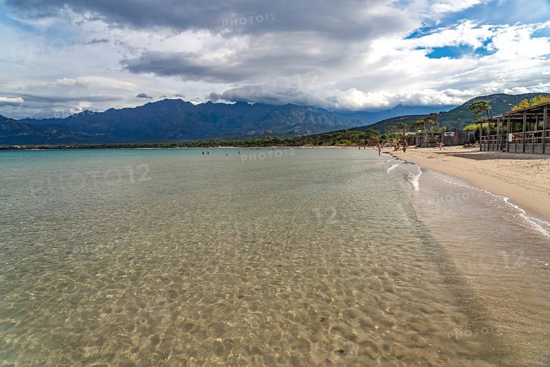 The beach and mountains at Calvi Bay, Balagne, Corsica, France