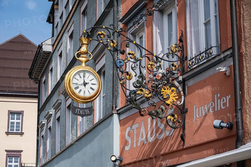 Traditional guild signs for watchmakers, nose sign with an oversized, gold pocket watch with Stauss lettering, a jewelry store in the historic old town of Rottweil, Rottweil district, Baden-Württemberg, Germany