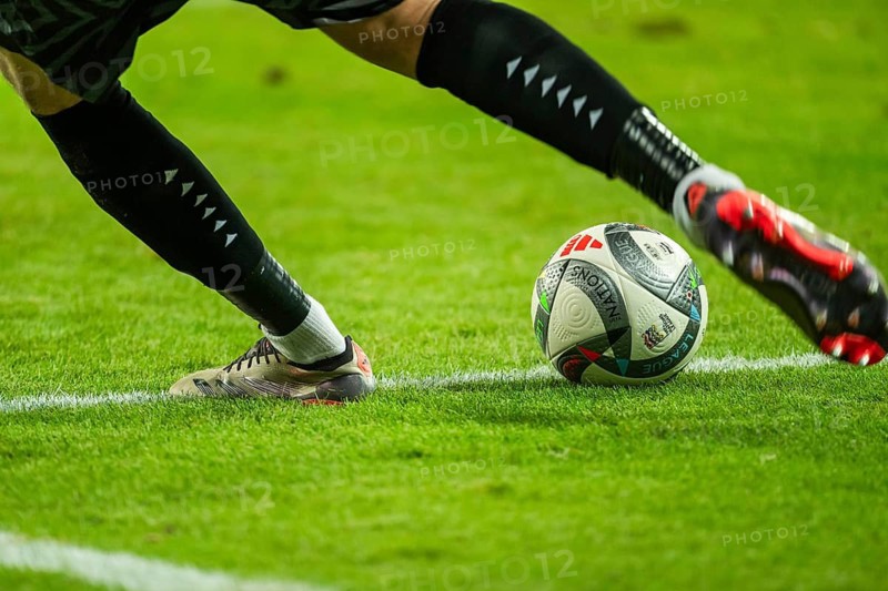 WROCLAW, POLAND - OCTOBER 14, 2024: UEFA Nations League match Ukraine - Czechia. Detail of the ball and player's legs.