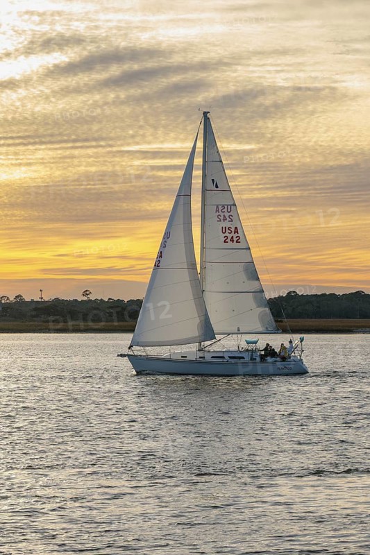 Sailboat sailing on the Tolomato River near Vilano Beach, Florida at sunset