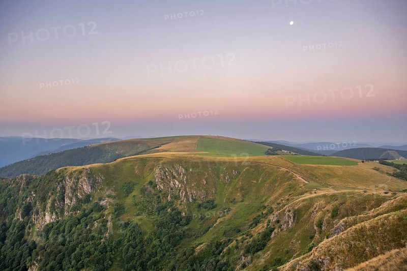 Sunrise mith the moon at Mount Hohneck in the Vosges Mountains, France