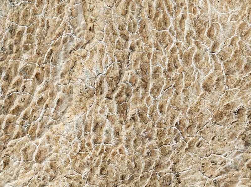 Abstract patterns of saline deposits at the salt works of Walvis Bay. Aerial view. Drone shot. Namibia