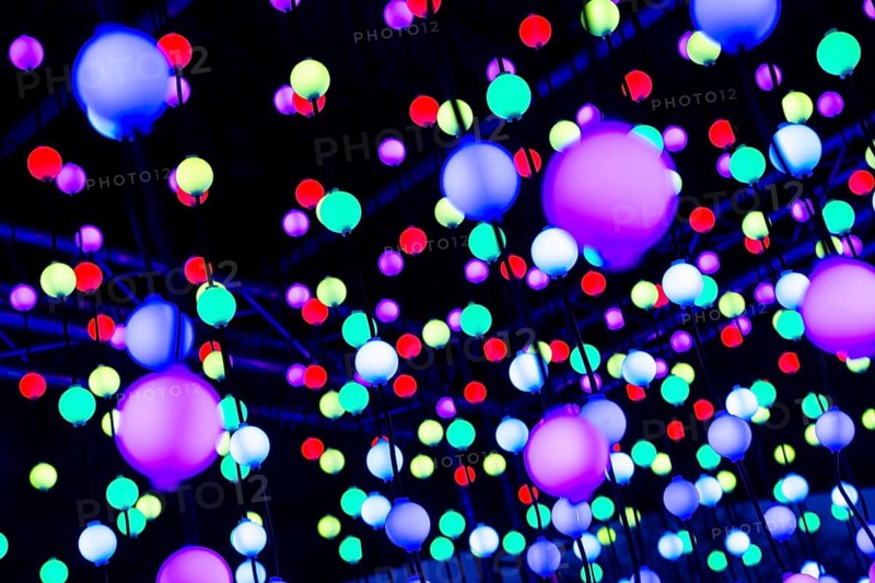 Light, glowing balls, LED lamps, hang in series, side by side, on top of each other, change their light color, light installation at park lights in the Grugapark in Essen