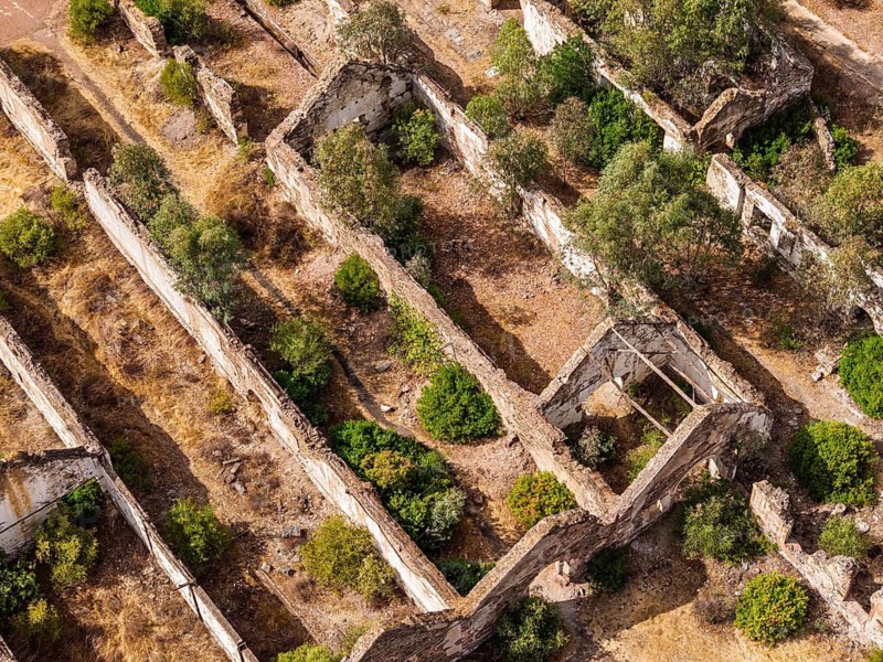 Ruins of former workshop halls, Mina de Sao Domingos, historic copper open-pit mine, aerial view, Portugal
