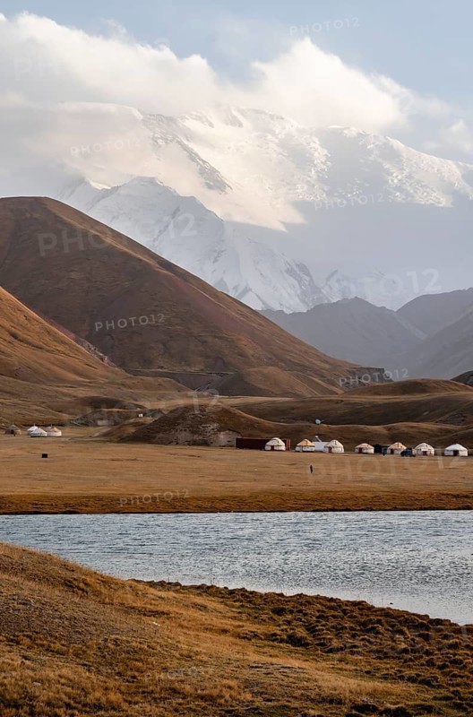 Yurts in front of Lenin Peak, Pamir Mountains, Osh Province, Kyrgyzstan