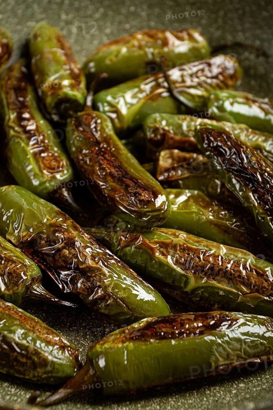 Fried padron pepper, in a frying pan, with olive oil, and sea salt, homemade, no people