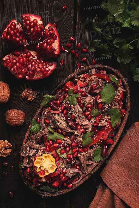 Georgian salad Tbilisi, boiled beef, with red beans and onions, sweet pepper, walnut and pomegranate, homemade, no people