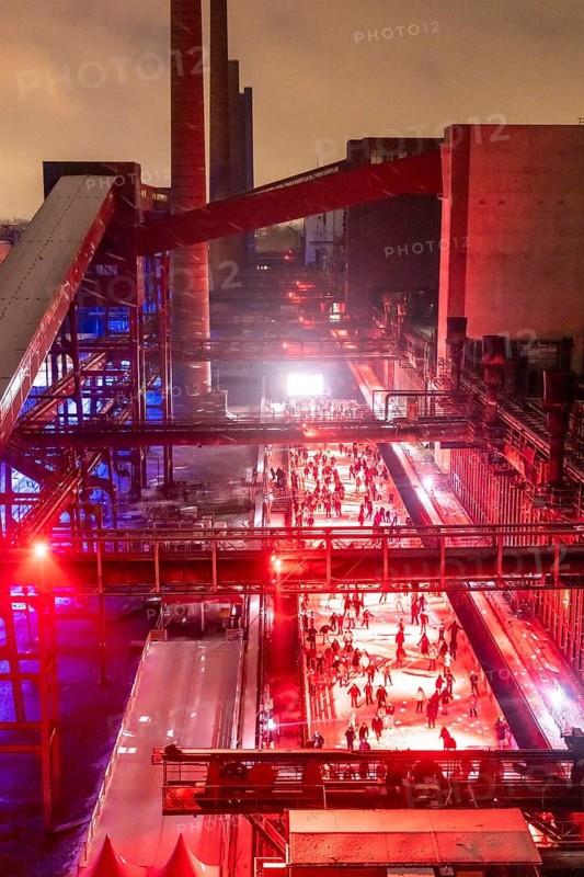 Ice rink at the Zollverein coking plant, ice skating with music and many lighting effects, Essen, North Rhine-Westphalia, Germany