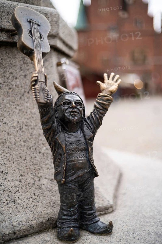 WROCLAW, POLAND - NOVEMBER 10, 2023: Statue of dwarves representing World Guinnes Record by playing guitars.