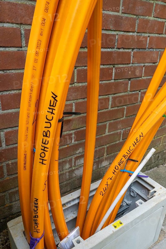 Distribution box in which empty conduits for fibre optic cables arrive and are connected, in which the actual fibre optic cable is later blown in and connected to the respective house connection. Essen, North Rhine-Westphalia, Germany