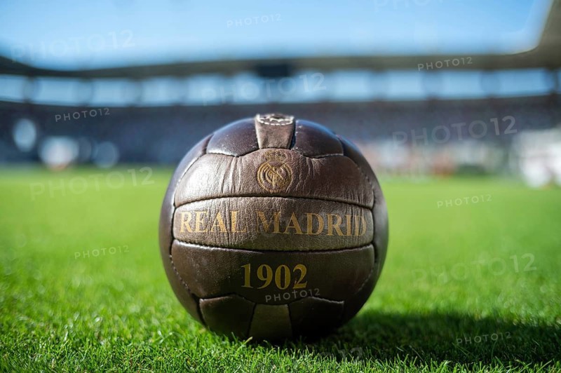 LUBIN, POLAND - SEPTEMBER 14, 2024: Old soccer ball with writing Real Madrid 1902 on the grass.