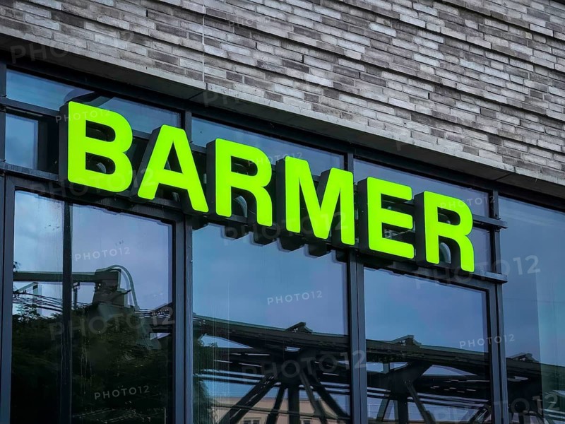 Illuminated lettering of Barmer Ersatzkasse on a façade in Elberfeld, Wuppertal, Germany