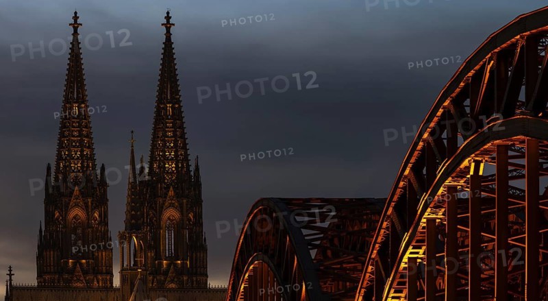 Evening atmosphere, Cologne Cathedral illuminated with LED lamps and the Hohenzollern Bridge, Cologne, North Rhine-Westphalia, Germany