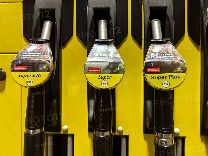 Dispenser at tank system gas station with hooked tank connector labelled with Super E10, Super E5, Super plus E5 lettering, Germany