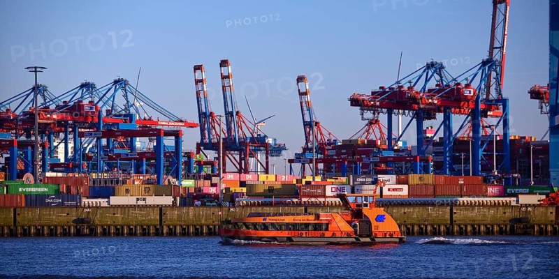 HADAG's harbour ferry MS Kehrwieder in front of the container gantry cranes at the Burchardkai container terminal in the Port of Hamburg, Germany