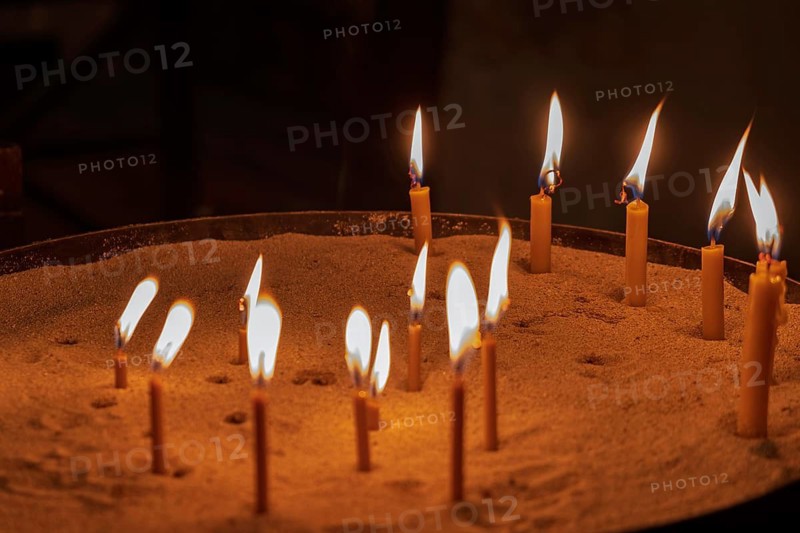 Sacrificial candles in a church, Apulia, Italy