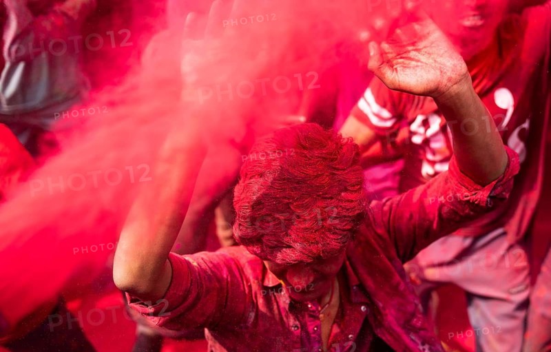 Revellers smear with Gulal or coloured powder and dance to play Holi, the Hindu spring festival of colours, on March 14, 2025 in Guwahati, India