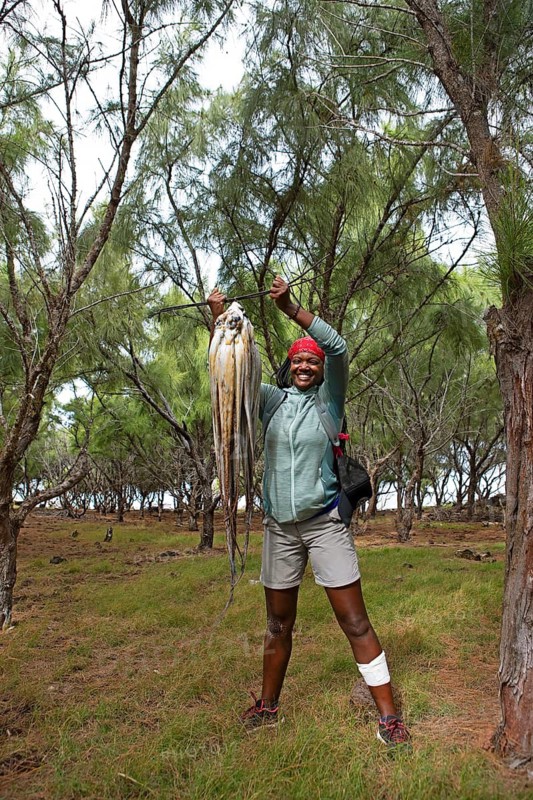 Mauritian woman, 35 years old, with an octopus, Rodrigues Island, Mauritius